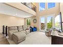 Bright living room features large windows, plush seating, and a stylish, open layout at 3159 Via Como, Henderson, NV 89044
