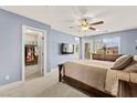 Serene bedroom with a walk-in closet, private balcony, and soft, natural light at 3159 Via Como, Henderson, NV 89044