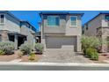 Contemporary home boasting a two-car garage, low-maintenance landscaping, and a welcoming facade at 4160 Elegant Chateau St, Las Vegas, NV 89135