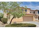Charming two-story home featuring a two-car garage, inviting landscaping at 4308 Desert Haven Ave, North Las Vegas, NV 89085