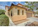 Charming two-story home featuring a two-car garage, inviting landscaping at 4308 Desert Haven Ave, North Las Vegas, NV 89085