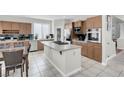 Well-equipped kitchen with stainless steel appliances, a center island, and wooden cabinets at 4326 Spooner Lake Cir, Las Vegas, NV 89147
