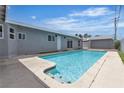 Refreshing backyard pool with tile accents and clear blue water, perfect for relaxation and entertainment at 4404 Hillcrest Ave, Las Vegas, NV 89102