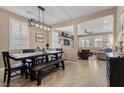Beautiful dining room with an elegant table, chair set, and modern lighting fixture at 465 Cabral Peak St, Las Vegas, NV 89138