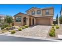 Charming two-story home boasts a well-maintained front yard and a spacious two-car garage at 465 Cabral Peak St, Las Vegas, NV 89138