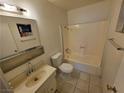 A simple bathroom with a vanity, toilet, and shower/tub combination at 5440 Swenson St # 18, Las Vegas, NV 89119