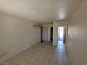 A basic room with tile floor and door leading to the bathroom at 5440 Swenson St # 18, Las Vegas, NV 89119
