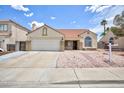 Inviting single-story home with a two car garage, desert landscaping, and classic architectural charm at 610 Playa Del Sol Way, Henderson, NV 89015