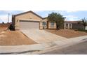 Beautiful single-story house with desert-style landscaping, a spacious driveway, and an attached two-car garage at 6140 Passionate Ct, North Las Vegas, NV 89031