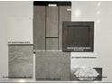 Selection of interior design materials, including flooring, counter tops, and cabinet colors at 64 Via Montoro, Henderson, NV 89011