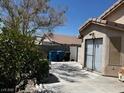 Backyard view of a covered patio with sliding door access, providing indoor-outdoor living space at 7850 Flagler St, Las Vegas, NV 89139
