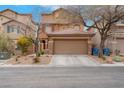 Two-story home with a two-car garage and low-maintenance desert landscaping at 7937 Granite Walk Ave, Las Vegas, NV 89178