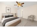 Inviting bedroom with a plush bed, soft lighting, and a calming color scheme for a relaxing retreat at 8934 Pomona Ct, Las Vegas, NV 89147