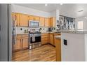 Well-equipped kitchen featuring stainless steel appliances, granite countertops, and light wood cabinetry at 10180 Delray Beach Ave # 202, Las Vegas, NV 89129