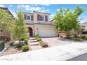 Charming two-story home with a well-maintained front yard and inviting curb appeal at 10829 Crestview Pointe Ave, Las Vegas, NV 89166