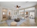 Inviting living room showcasing an open layout to the kitchen and dining area at 177 Shaded Peak St, Henderson, NV 89012