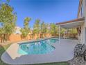 Inviting backyard pool with a covered patio, perfect for relaxation and outdoor entertainment at 2732 Dune Cove Rd, Las Vegas, NV 89117