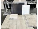Interior design sample showcasing sleek chrome faucet, benton flagstone cabinets, and avery circle champagne toast carpet at 2766 Via Napoli, Henderson, NV 89044