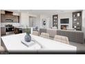 Bright living area featuring a fireplace, built-in shelving and a kitchen with stainless appliances at 329 Blossom Wind St # Lot 14, Henderson, NV 89015