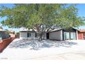 Charming single-story home with xeriscaping and mature shade tree at 404 Vassar Ln, Las Vegas, NV 89107