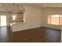 Bright living room open to the kitchen, featuring modern flooring and fresh paint at 404 Vassar Ln, Las Vegas, NV 89107