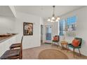 Bright dining area with decorative chandelier and large window at 50 Aura De Blanco St # 2104, Henderson, NV 89074