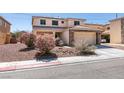 Charming two-story home with a tile roof, stone accents, and a well-manicured front yard at 6052 Puesta Del Sol St, North Las Vegas, NV 89081