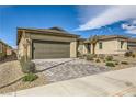 Inviting single-story home with a neutral exterior and a paved driveway at 6607 Summershade St, North Las Vegas, NV 89086