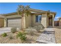 Attractive one-story home featuring a neutral color scheme and xeriscaping at 6607 Summershade St, North Las Vegas, NV 89086