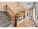 Dining area with hardwood floors, adjacent to the stairway and natural light at 8220 Chimney Bluffs St, North Las Vegas, NV 89085