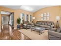 Bright living room with hardwood floors, neutral paint, and modern furnishings at 8220 Chimney Bluffs St, North Las Vegas, NV 89085