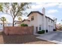 Charming two-story home with desert landscaping, block wall and inviting curb appeal at 944 Angel Star Ln, Las Vegas, NV 89145