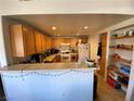 This kitchen offers plenty of storage and countertop area for everyday use at 9580 W Reno Ave # 283, Las Vegas, NV 89148