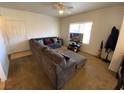 Comfortable living room with a plush sectional sofa, tv, and a neutral color palette at 9580 W Reno Ave # 283, Las Vegas, NV 89148