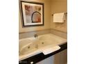 Relax in the jetted soaking tub with black marble surround, offering a spa-like experience at 125 E Harmon Ave # 2918, Las Vegas, NV 89109
