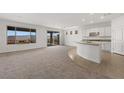 Spacious open-concept living area featuring a seamless transition between the living space and kitchen at 1398 Pin Cushion Rdg, Mesquite, NV 89034