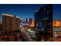 Nighttime scene of the city with high-rise residential towers at 145 E Harmon Ave # 2409, Las Vegas, NV 89109