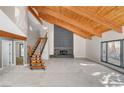 Open-concept living area showcasing a fireplace, and staircase, filled with natural light at 1600 Becke Cir, Las Vegas, NV 89104