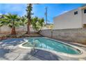 Inviting backyard pool offers a refreshing escape with ample space for relaxation and entertainment at 1600 Becke Cir, Las Vegas, NV 89104