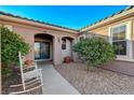 Home featuring a tiled roof, decorative front doors, and meticulously manicured desert landscaping at 2039 Colvin Run Dr, Henderson, NV 89052