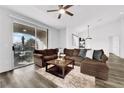 Inviting living room boasts natural light, hardwood flooring, and an open concept layout at 2325 Windmill Pkwy # 1023, Henderson, NV 89074