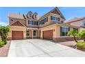 Inviting two-story home with a three car garage and classic architectural details at 2521 Cattrack Ave, North Las Vegas, NV 89081