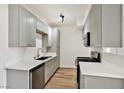 Charming kitchen with grey cabinets, sleek countertops, and stainless steel appliances at 3318 N Decatur Blvd # 1107, Las Vegas, NV 89130