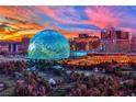 Panoramic cityscape showcasing the Sphere and other iconic buildings under a gorgeous sunset at 360 E Desert Inn Rd # 1803, Las Vegas, NV 89109
