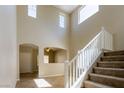 Spacious entryway with staircase, high ceilings, and views into adjacent rooms at 3615 Dutchmans Vine Ct, North Las Vegas, NV 89081
