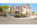 Charming corner lot home featuring a white fence, neat landscaping, and a welcoming facade at 3954 Crystal Trip Ct, Las Vegas, NV 89129