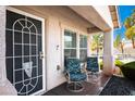 Cozy porch area with comfortable seating and a secure screen door entrance at 3954 Crystal Trip Ct, Las Vegas, NV 89129