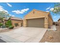 Charming single-story home with a well-manicured front yard and a two-car garage in a residential neighborhood at 4062 Vulcan St, Las Vegas, NV 89122