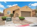 Charming single-story home with a well-manicured front yard and a two-car garage in a residential neighborhood at 4062 Vulcan St, Las Vegas, NV 89122