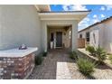 Inviting entryway with brick-paved walkway and decorative accents at 417 Honeybrush Ave, Henderson, NV 89011